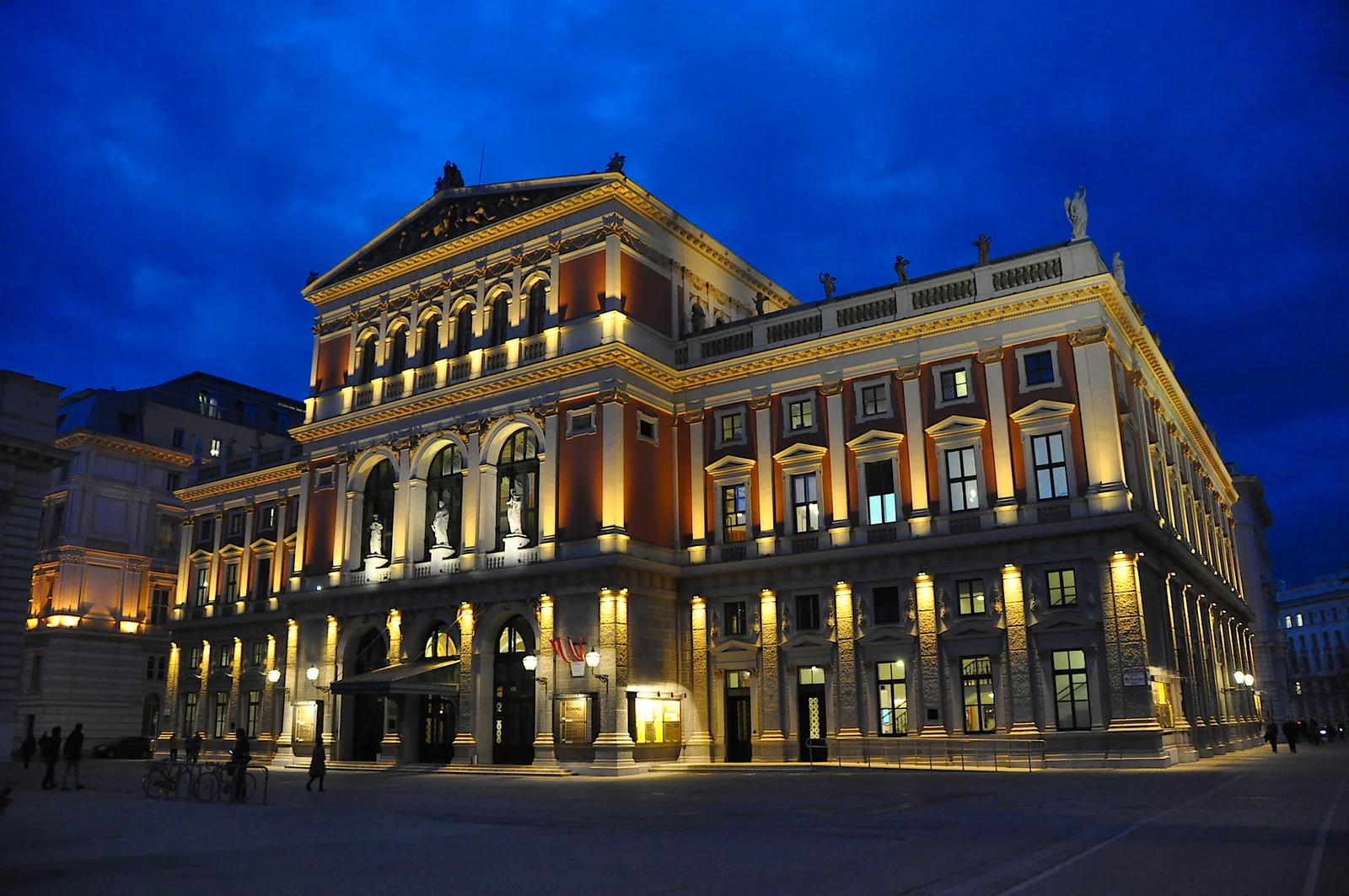 Exterior of the Musikverein concert venue in Vienna, illuminated at dusk